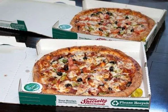 Photo of the first two pizzas bought with bitcoins